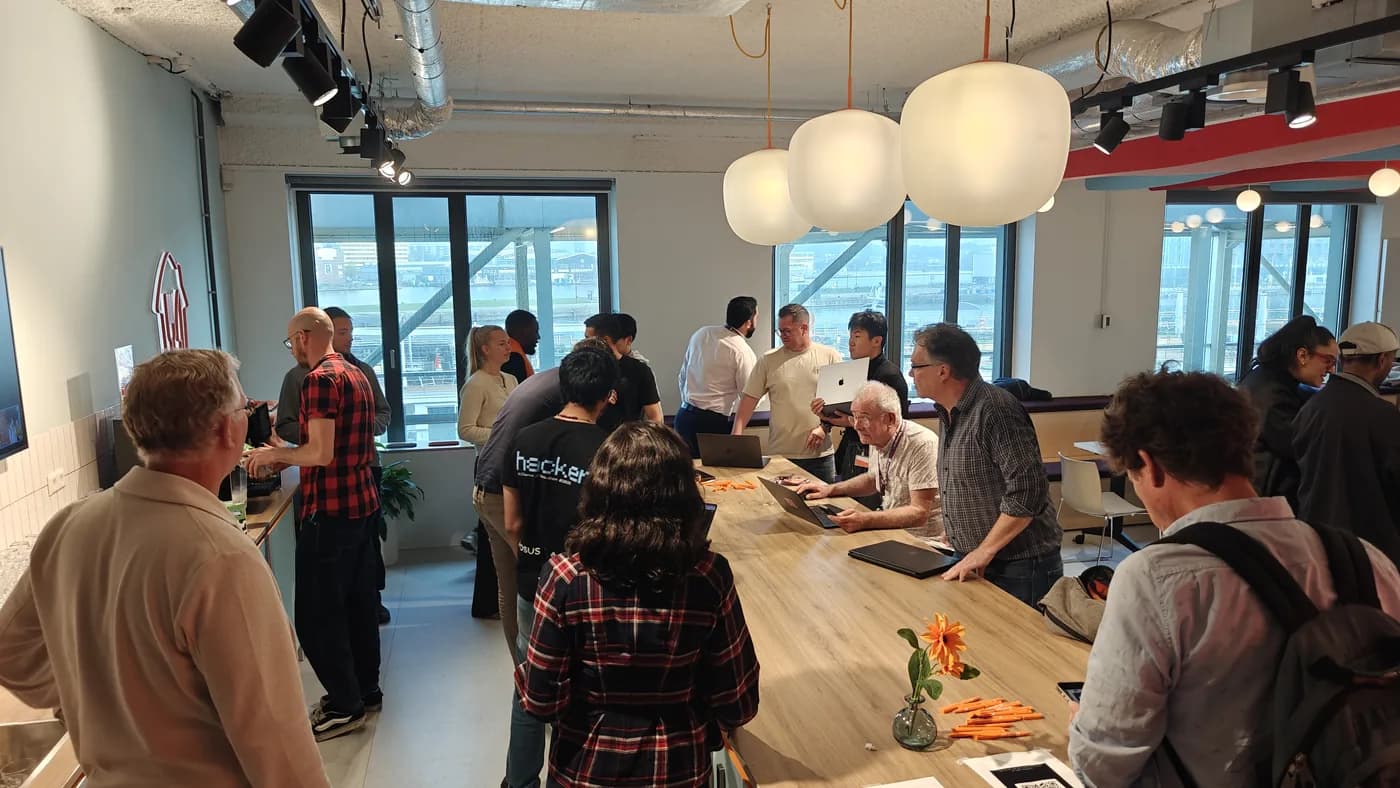 Teams gathered round the long table mid-build